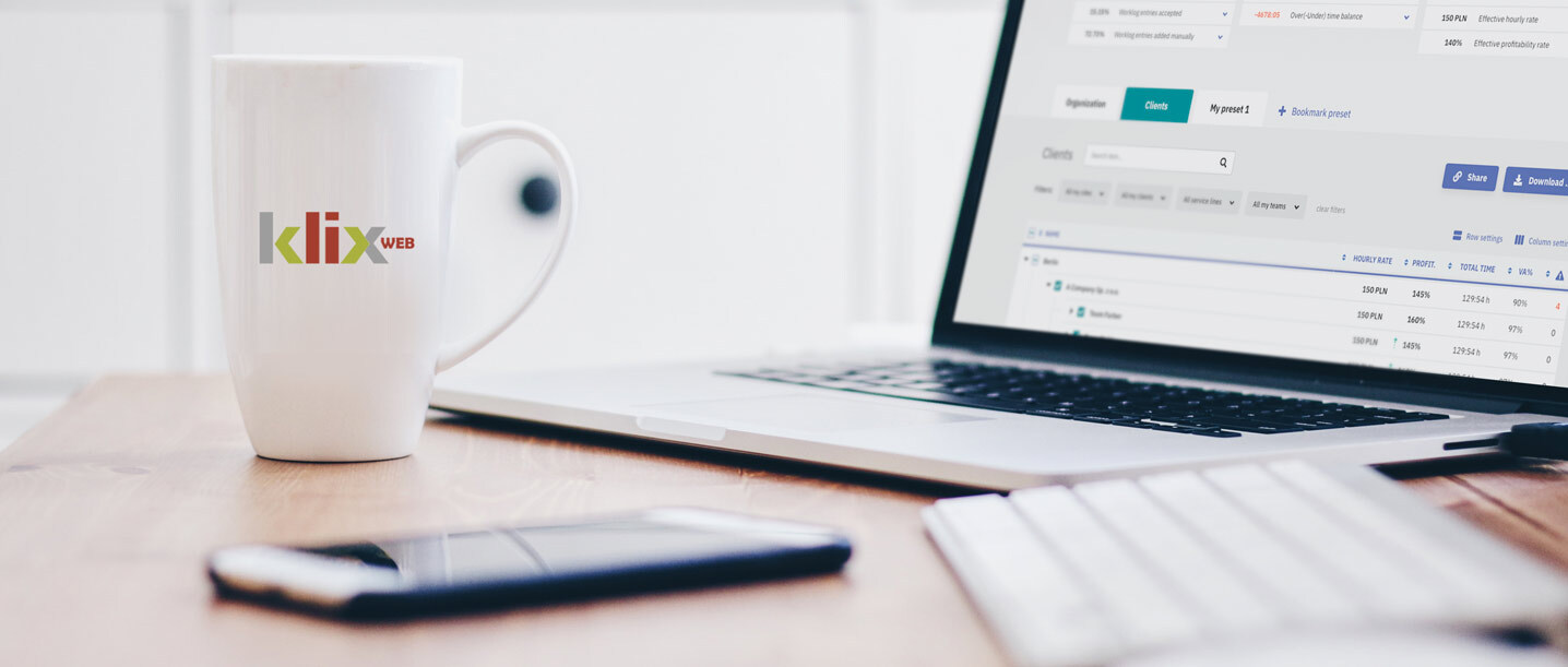 A laptop with Klix app and a mug with Klix logo
